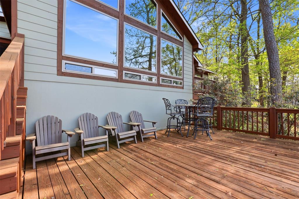 307 South Park Road Scroggins, TX 75480 - Photo 25 of 33 a balcony with wooden benches and a bench