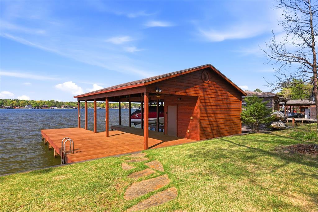 307 South Park Road Scroggins, TX 75480 - Photo 26 of 33 a view of a house with backyard and sitting area