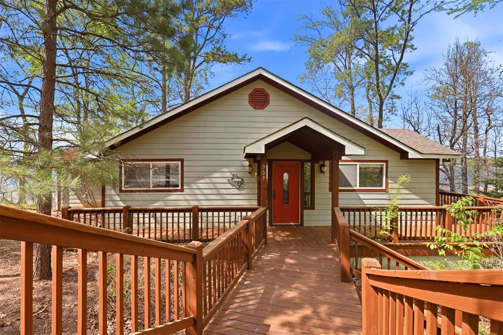 307 South Park Road Scroggins, TX 75480 - Photo 33 of 33 a view of a wooden house with a small yard