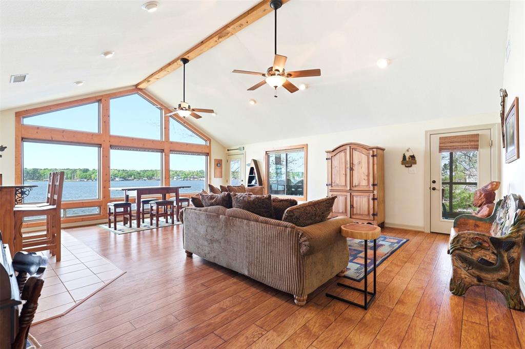 307 South Park Road Scroggins, TX 75480 - Photo 8 of 33 a living room with furniture a ceiling fan and a large window