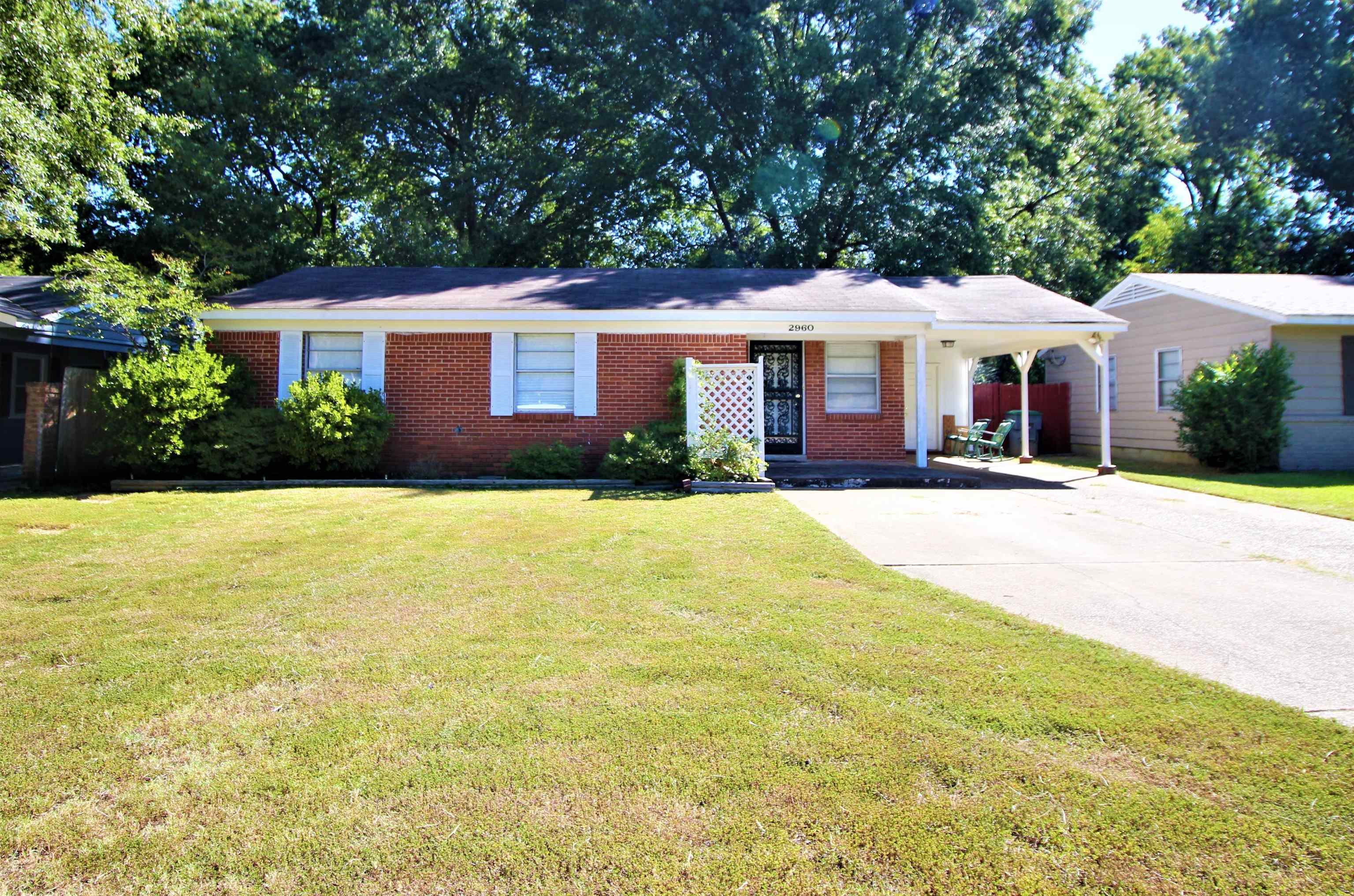 2960 Cherry Road Memphis, TN 38118 - Photo 1 of 16 a front view of a house with yard and green space