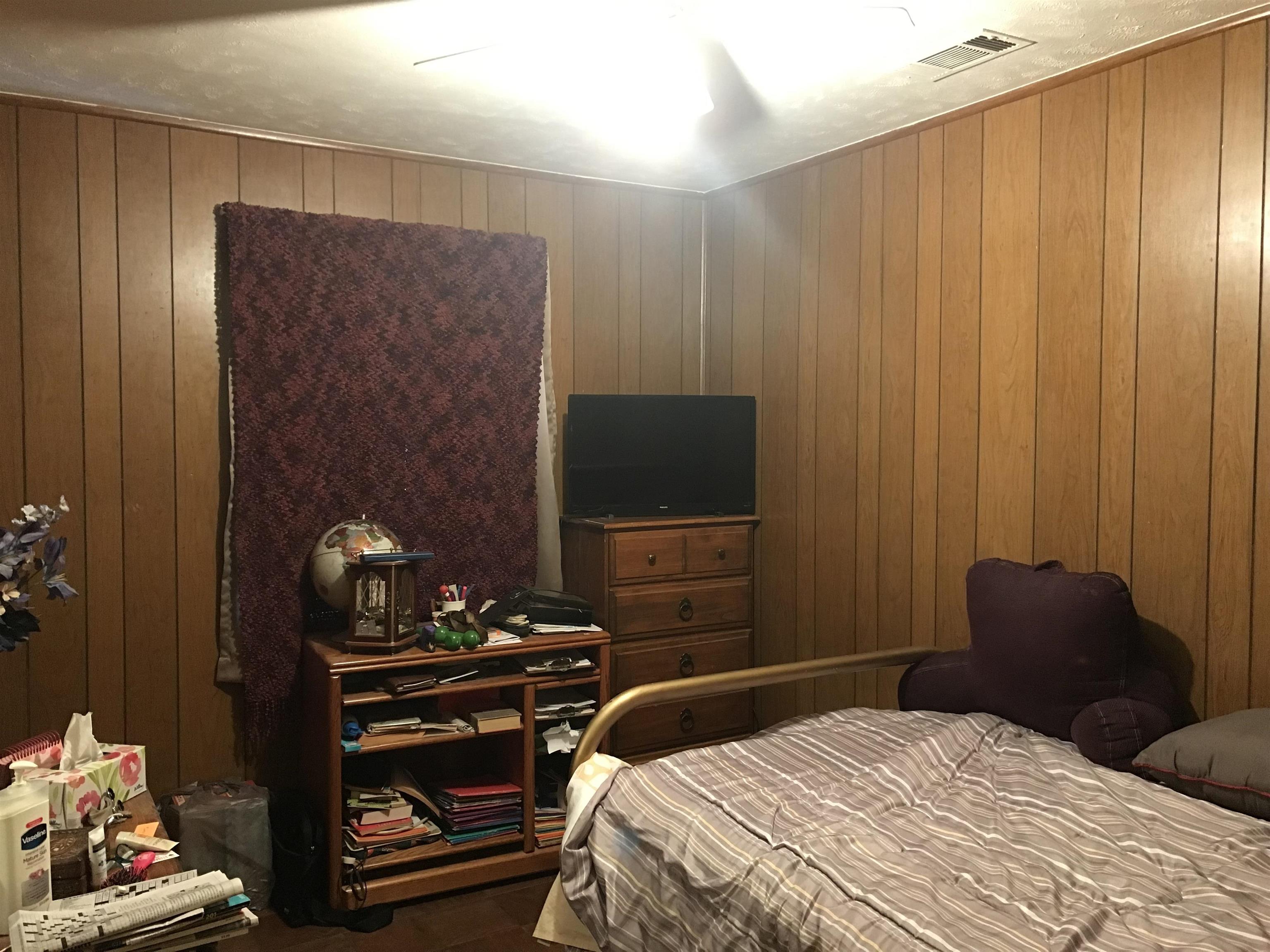 2960 Cherry Road Memphis, TN 38118 - Photo 11 of 16 a bedroom with a bed and a flat screen tv