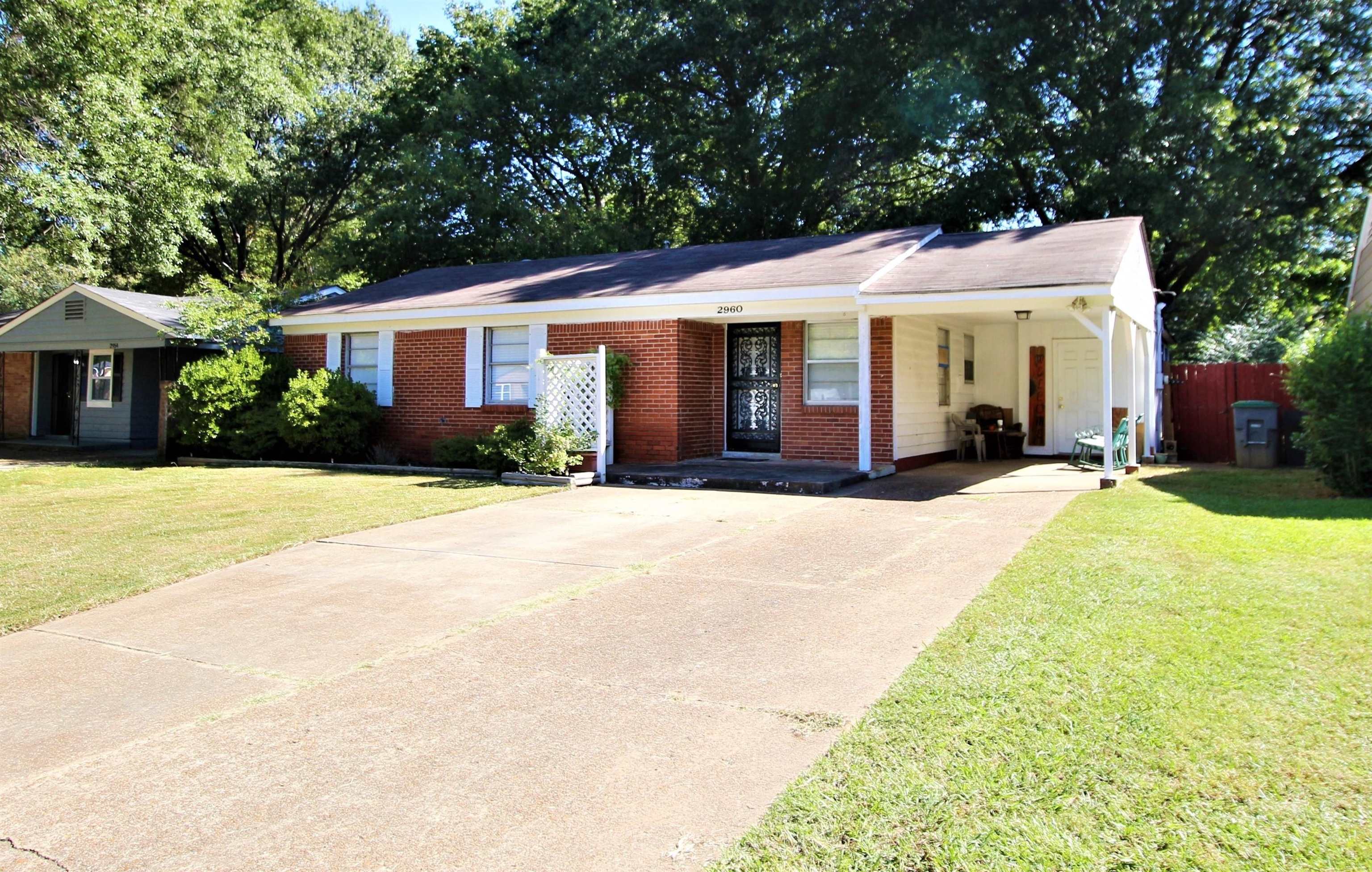 2960 Cherry Road Memphis, TN 38118 - Photo 2 of 16 a front view of a house with a yard and potted plants