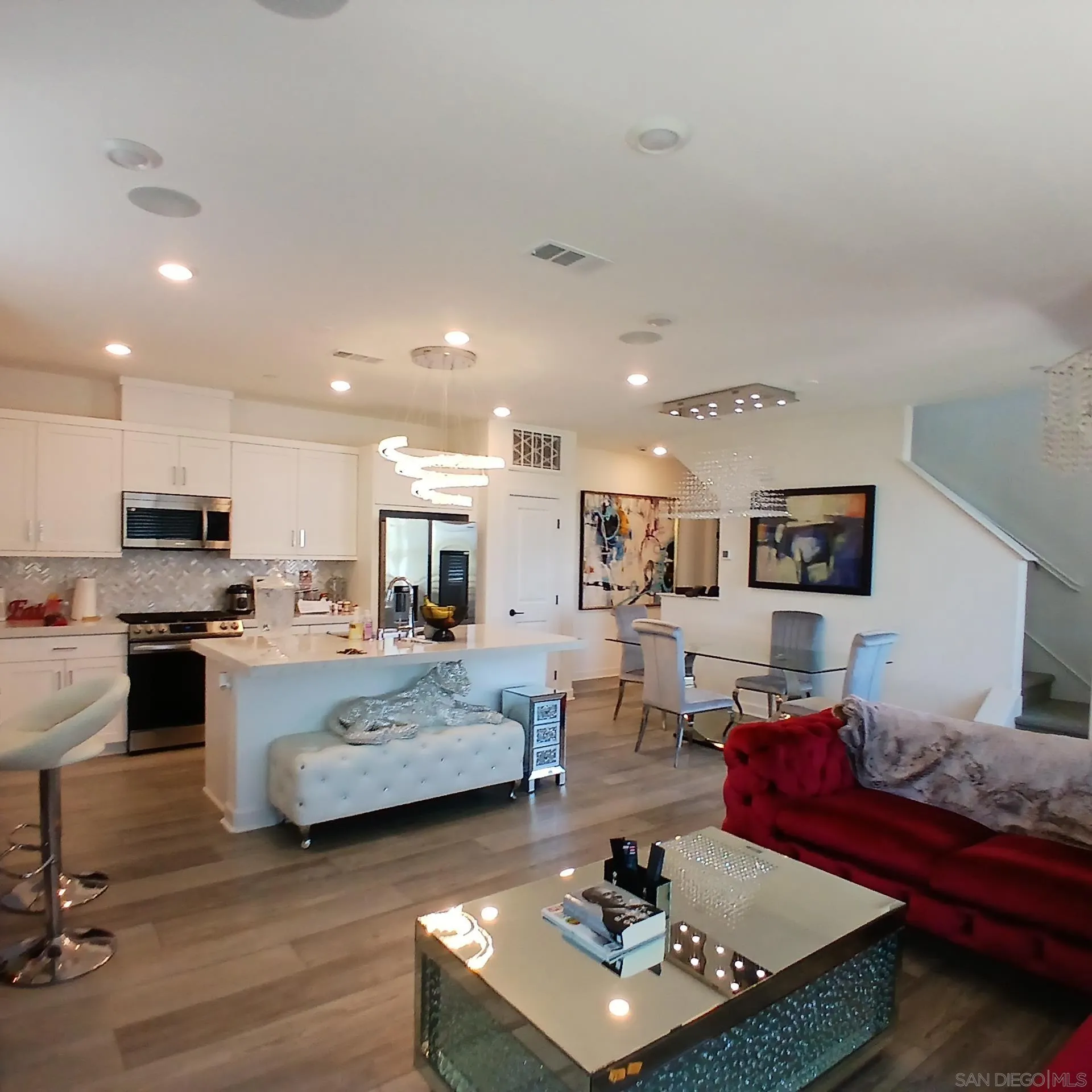 2430 Cascalote Loop San Diego, CA 92154 - Photo 2 of 19 a living room with furniture and a view of kitchen