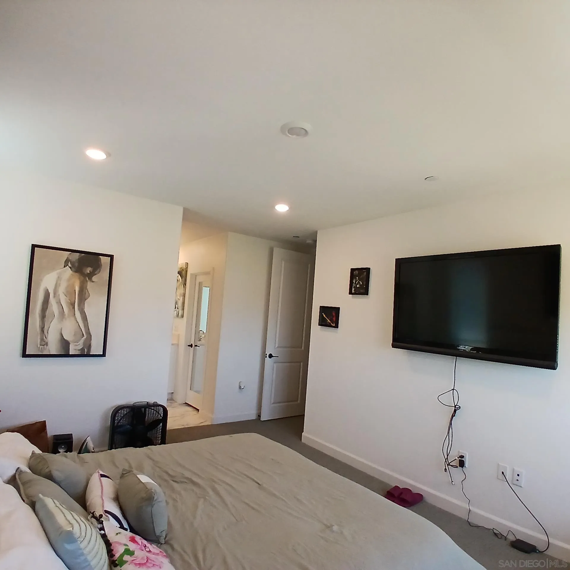 2430 Cascalote Loop San Diego, CA 92154 - Photo 5 of 19 a bedroom with a bed and a flat screen tv
