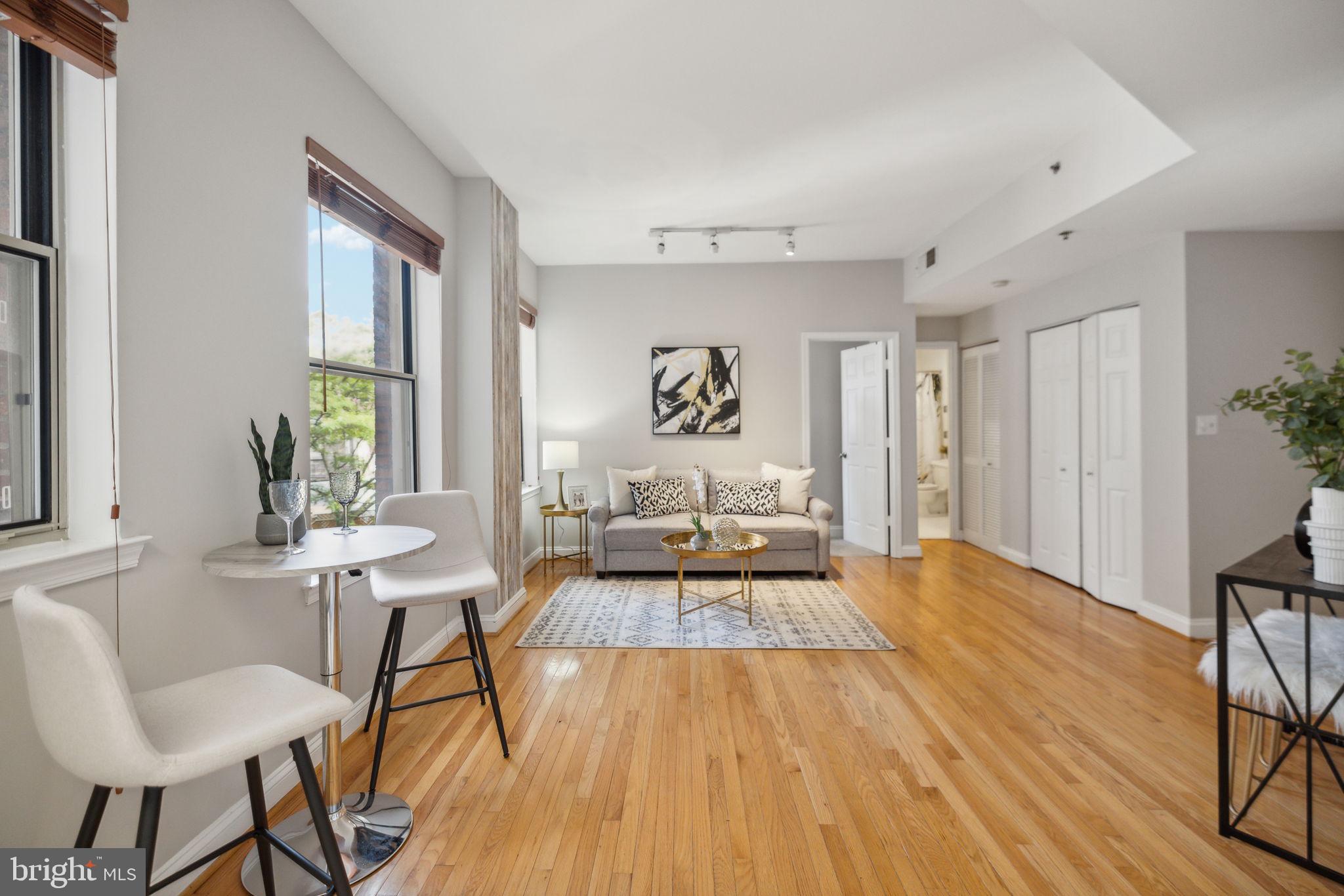 1621 T Street Northwest, Unit 307 Washington, DC 20009 - Photo 4 of 15 a living room with furniture and a wooden floor