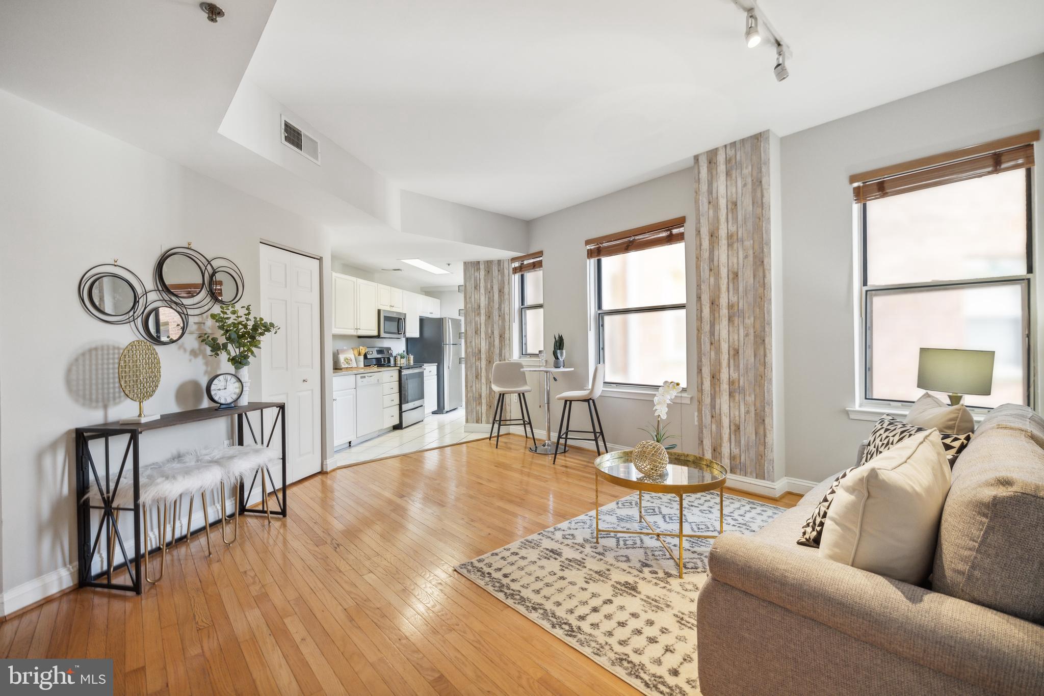 1621 T Street Northwest, Unit 307 Washington, DC 20009 - Photo 5 of 15 a living room with furniture and wooden floor