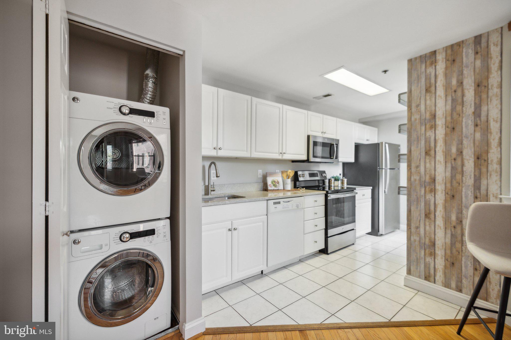 1621 T Street Northwest, Unit 307 Washington, DC 20009 - Photo 8 of 15 a view of a kitchen with washer and dryer