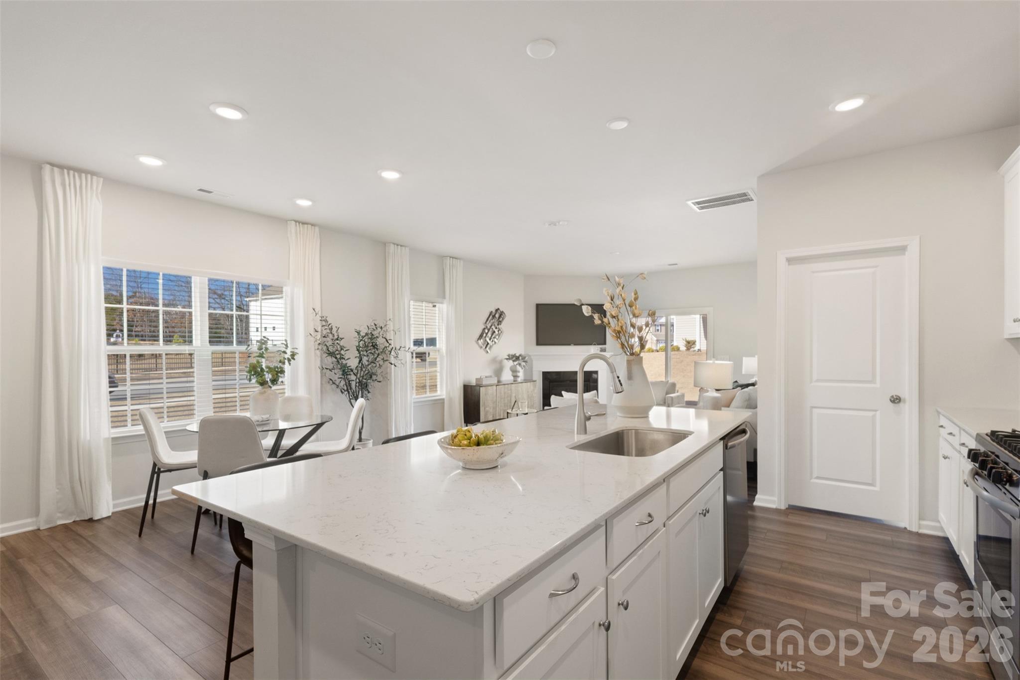 15224 Lake Ridge Road Charlotte, NC 28278 - Photo 11 of 32 a kitchen with stainless steel appliances granite countertop a sink and a refrigerator