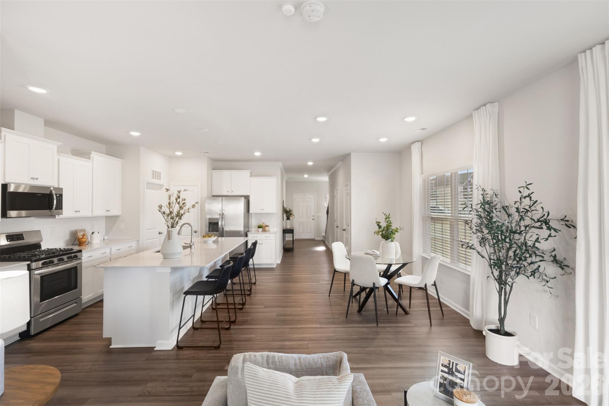 15224 Lake Ridge Road Charlotte, NC 28278 - Photo 12 of 32 a living room with furniture kitchen view and a potted plant