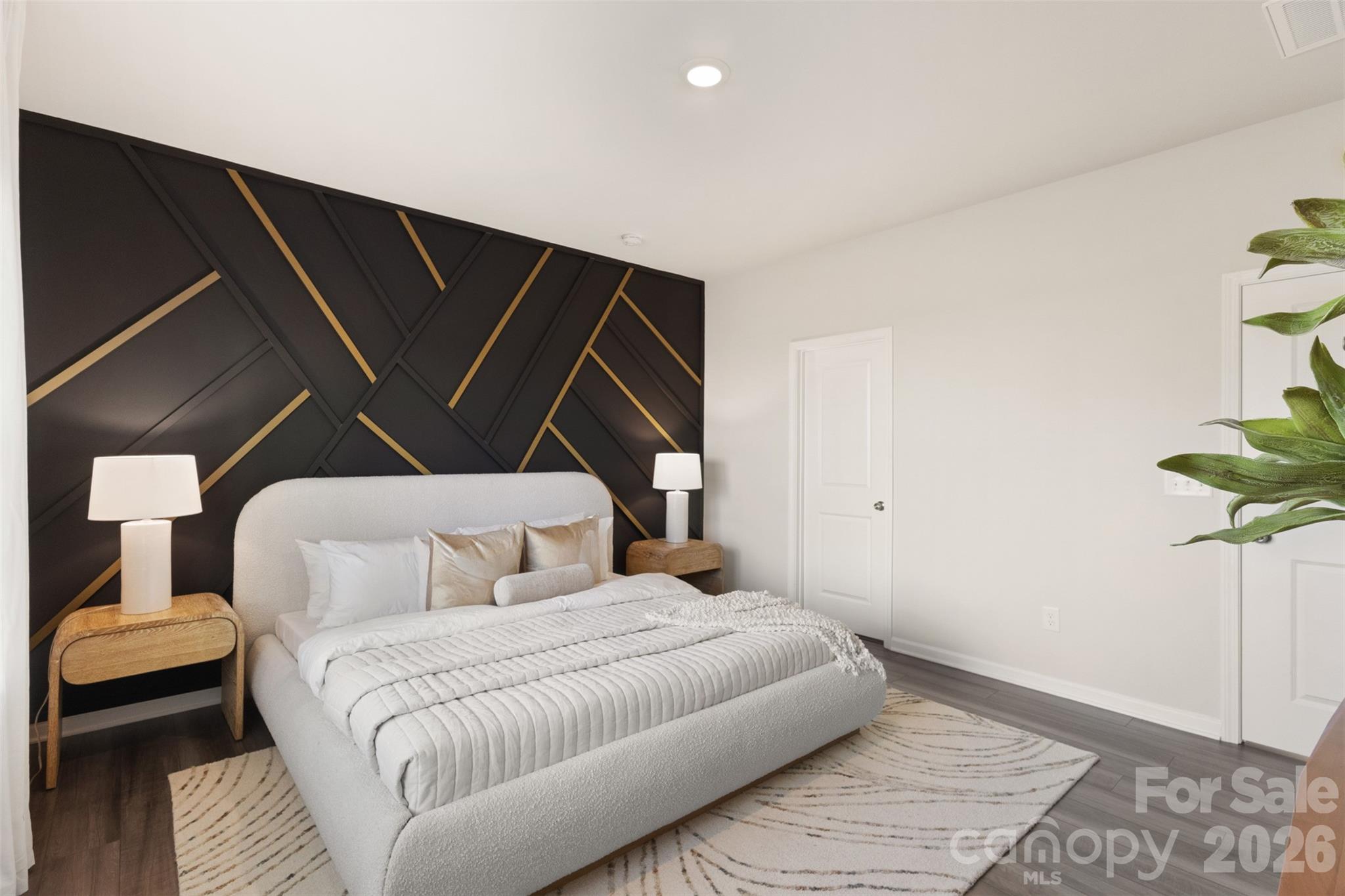 15224 Lake Ridge Road Charlotte, NC 28278 - Photo 15 of 32 a bedroom with a bed and a mirror