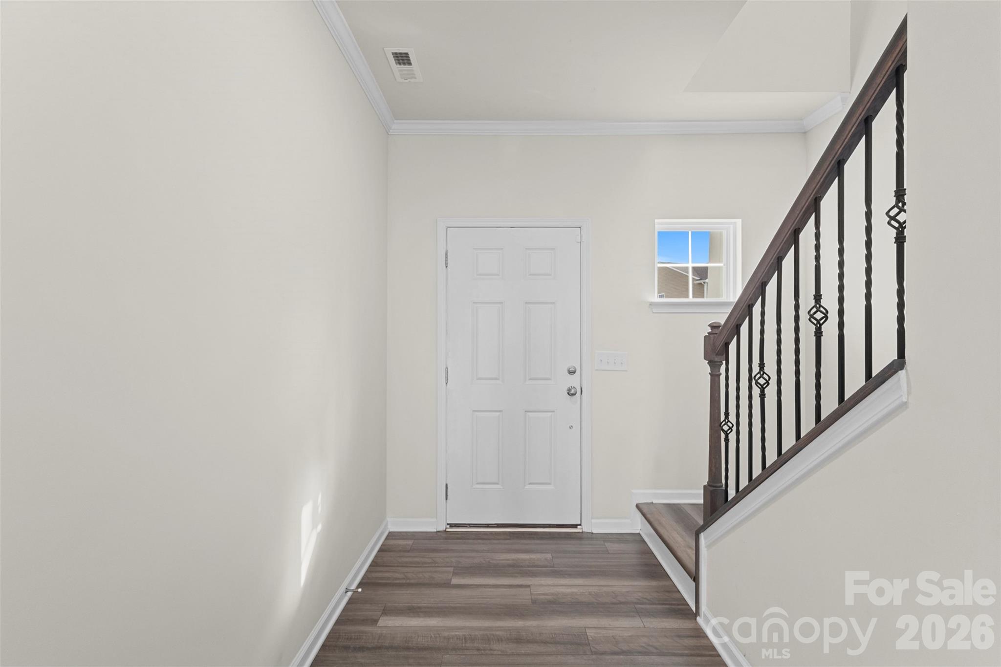 15224 Lake Ridge Road Charlotte, NC 28278 - Photo 22 of 32 a view of a hallway with wooden floor and staircase