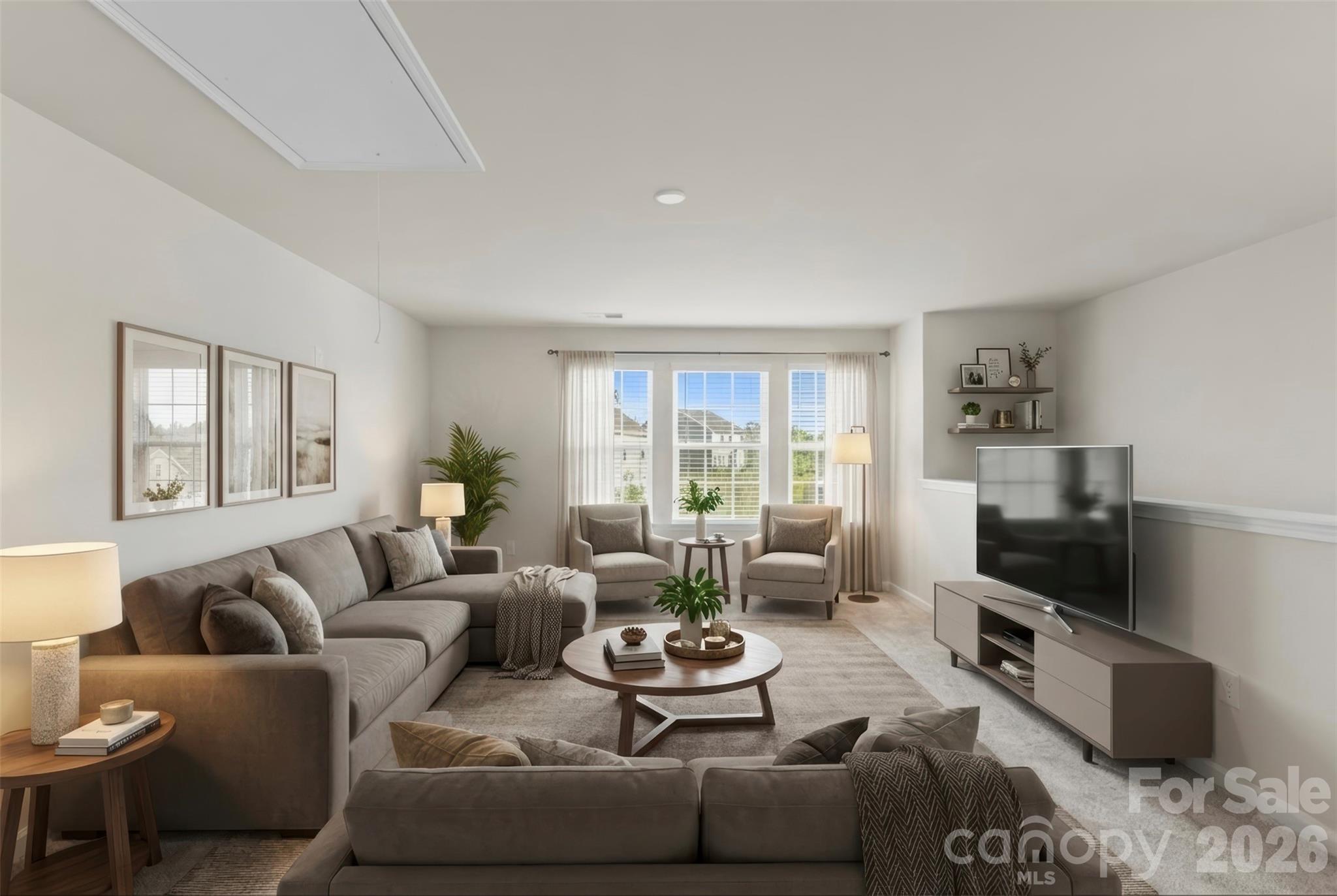 15224 Lake Ridge Road Charlotte, NC 28278 - Photo 23 of 32 a living room with furniture a flat screen tv and a window