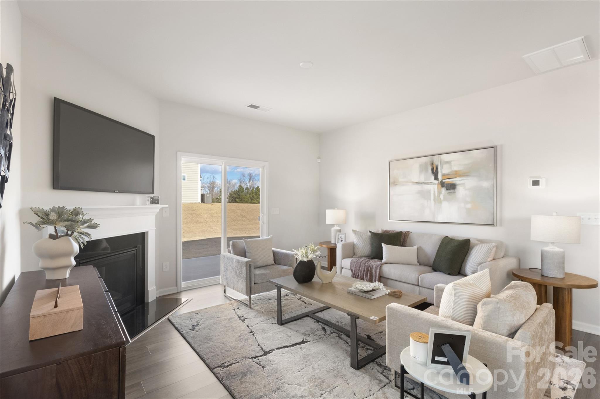 15224 Lake Ridge Road Charlotte, NC 28278 - Photo 4 of 32 a living room with furniture and a flat screen tv