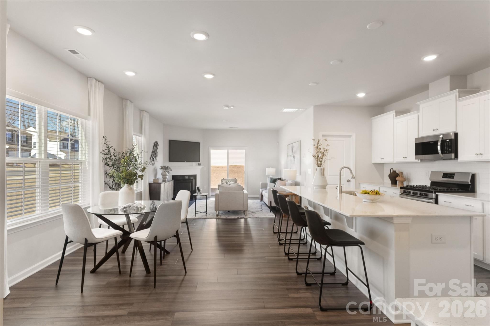 15224 Lake Ridge Road Charlotte, NC 28278 - Photo 6 of 32 a view of a dining room with furniture window and wooden floor