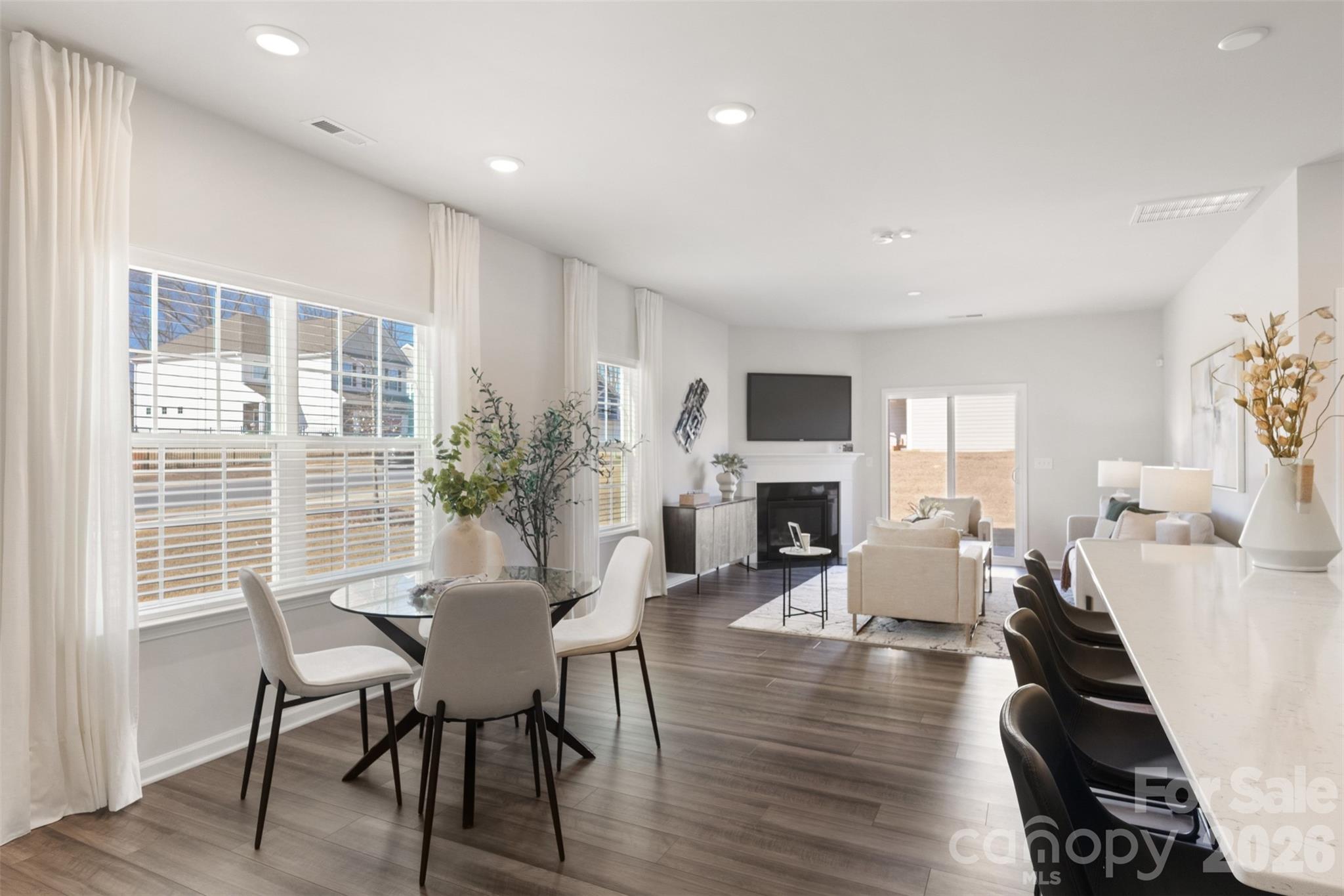 15224 Lake Ridge Road Charlotte, NC 28278 - Photo 7 of 32 a view of a dining room with furniture window and wooden floor