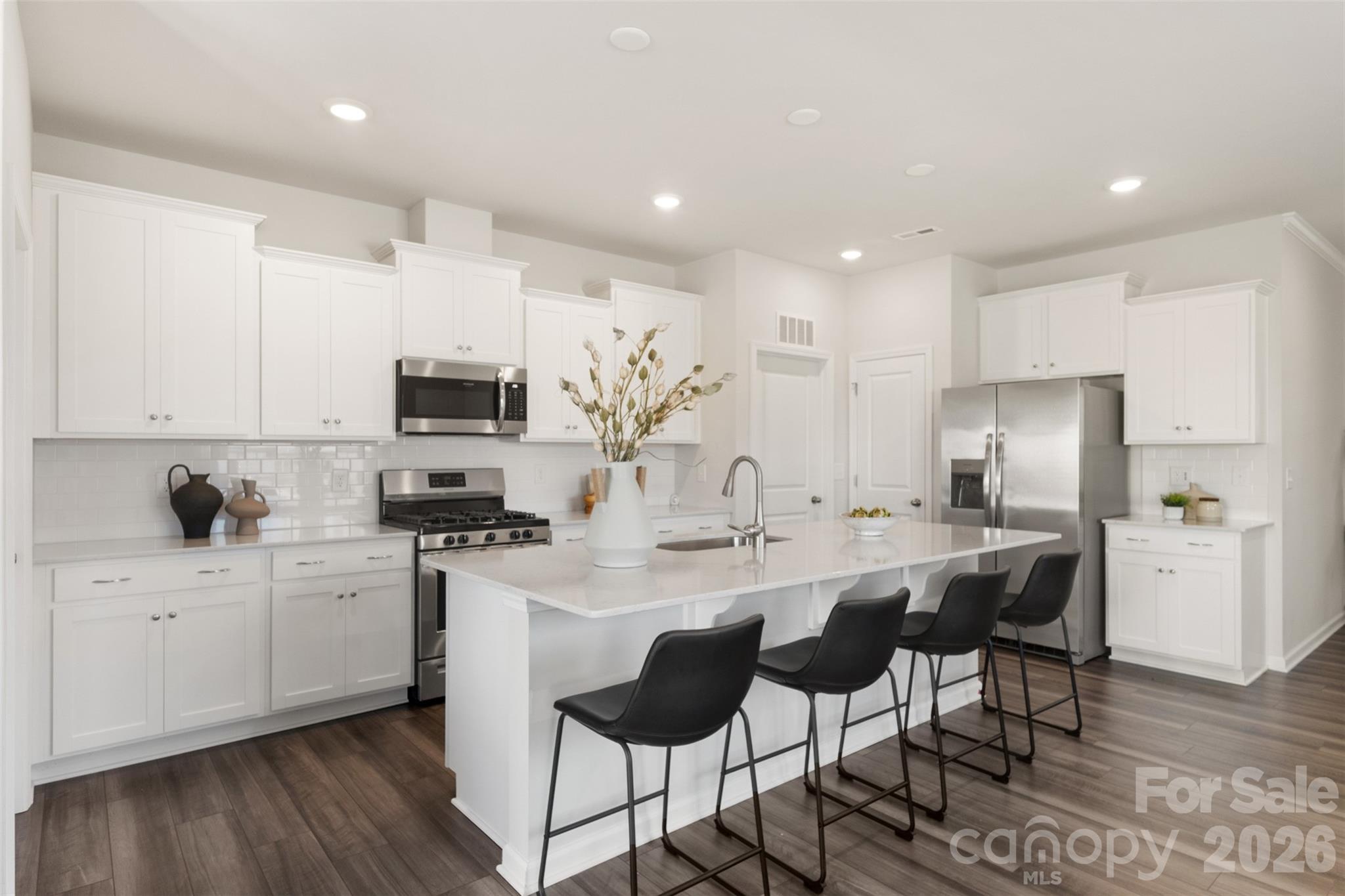 15224 Lake Ridge Road Charlotte, NC 28278 - Photo 9 of 32 a kitchen with appliances a sink and cabinets