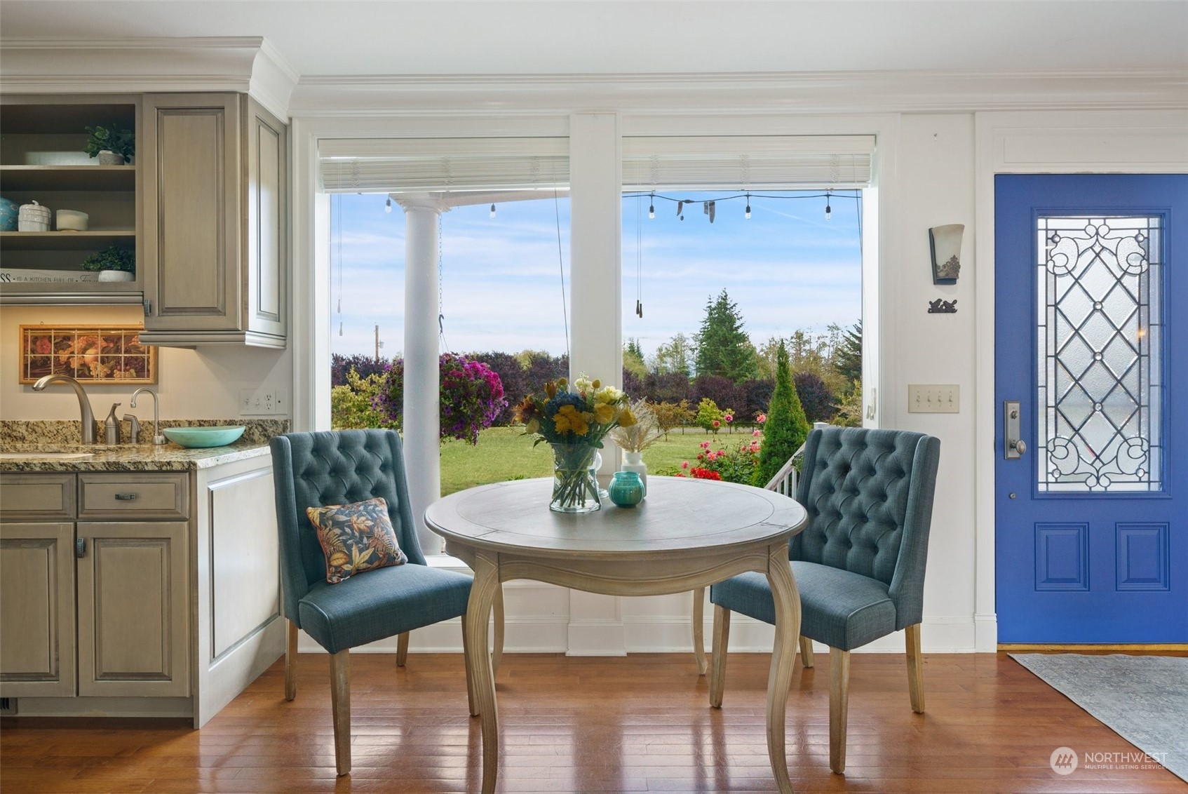 9435 Weidkamp Road Lynden, WA 98264 - Photo 11 of 40 a view of a dining room with furniture window and wooden floor