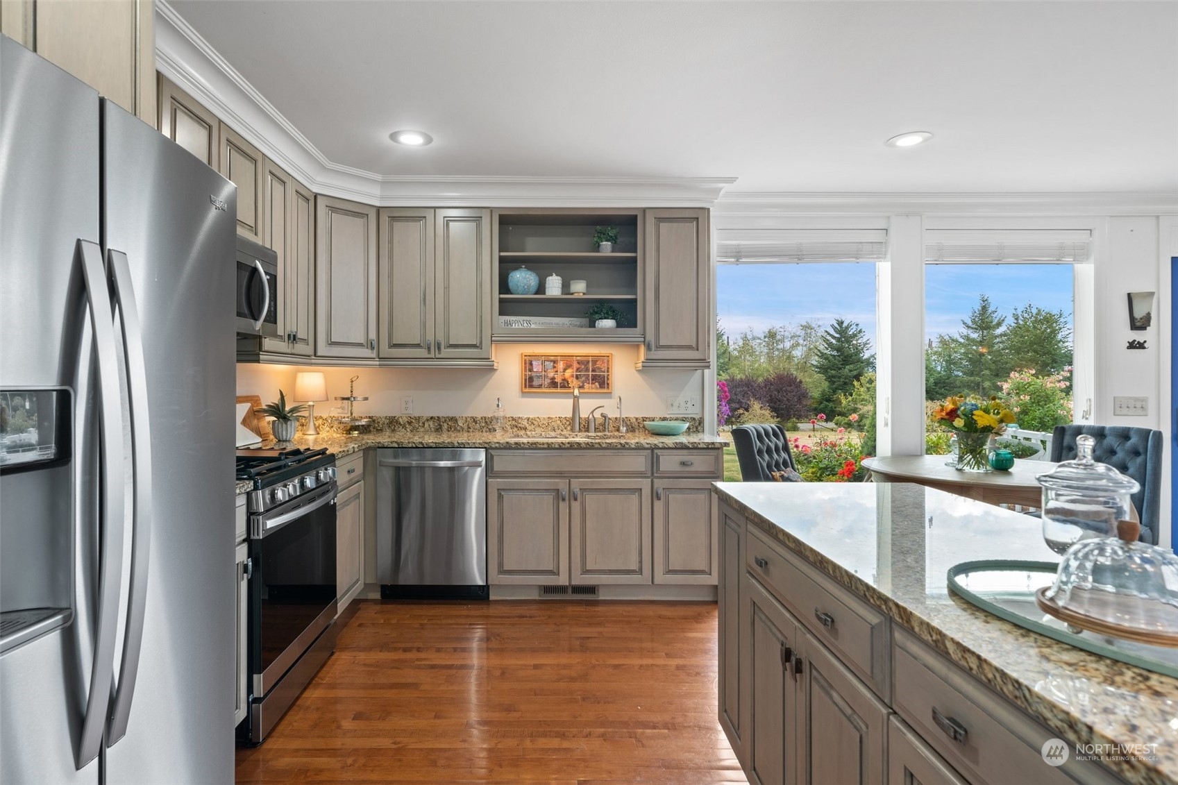 9435 Weidkamp Road Lynden, WA 98264 - Photo 13 of 40 a kitchen with stainless steel appliances granite countertop a sink stove and refrigerator