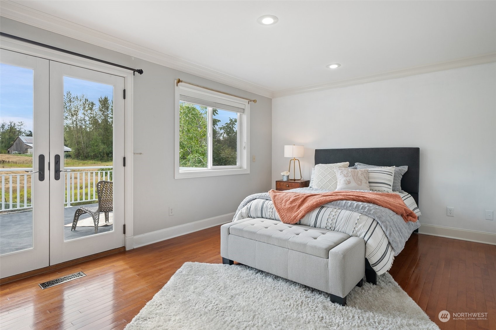 9435 Weidkamp Road Lynden, WA 98264 - Photo 18 of 40 a bedroom with a bed and glass window