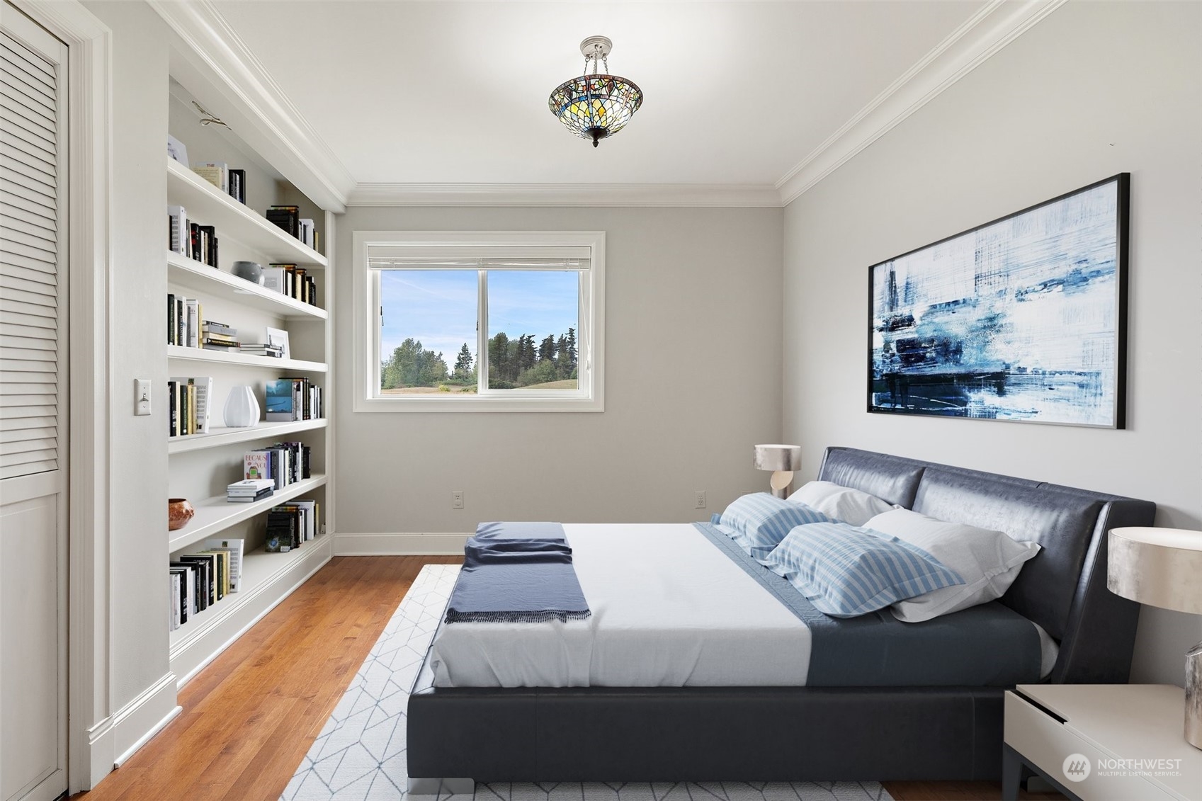 9435 Weidkamp Road Lynden, WA 98264 - Photo 19 of 40 a bedroom with a bed and a book shelf