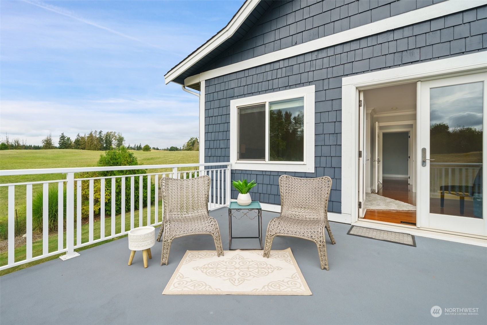 9435 Weidkamp Road Lynden, WA 98264 - Photo 20 of 40 a view of a patio with a table and chairs