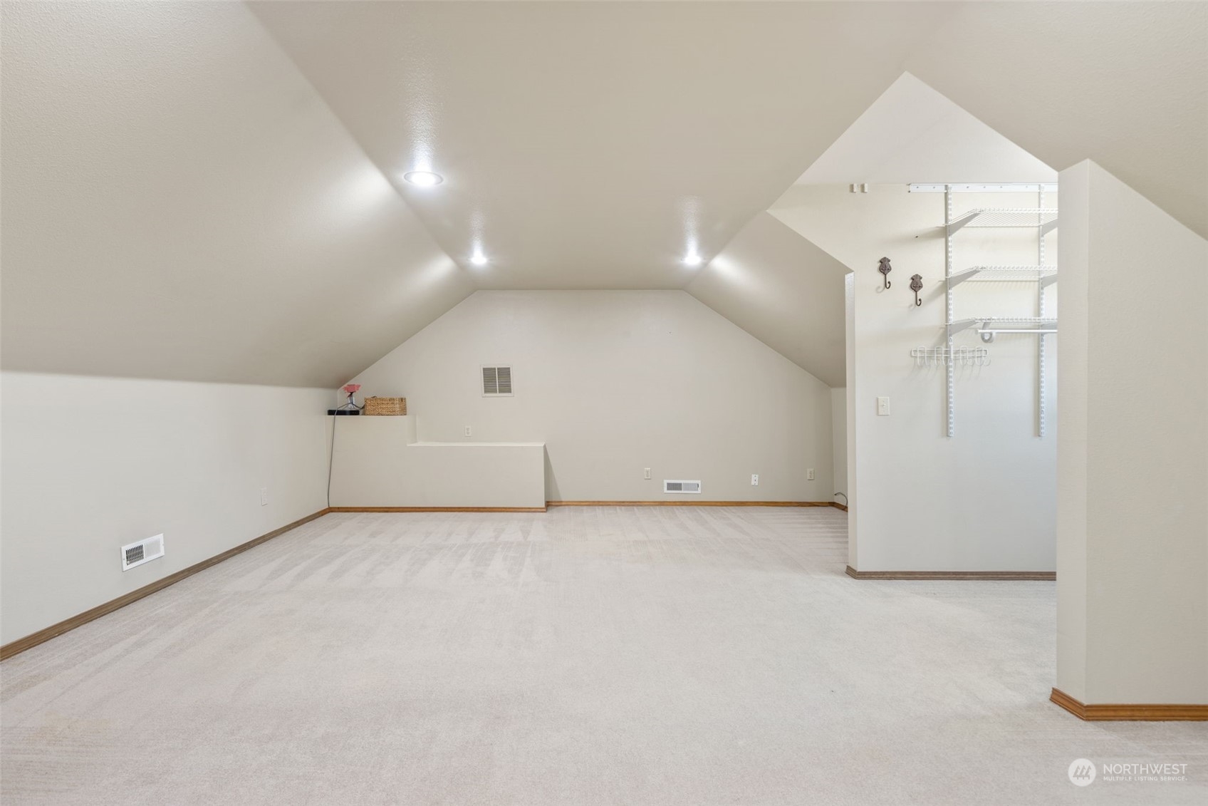 9435 Weidkamp Road Lynden, WA 98264 - Photo 21 of 40 an empty room with a projector and white walls