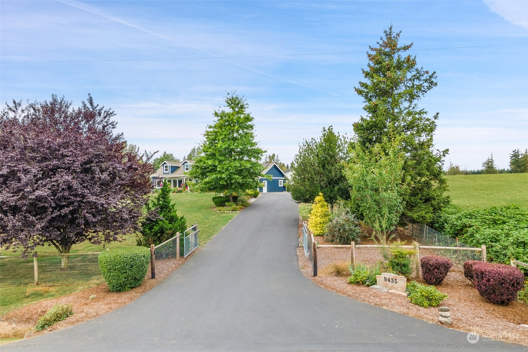 9435 Weidkamp Road Lynden, WA 98264 - Photo 29 of 40 a view of a street with a tree in front of it