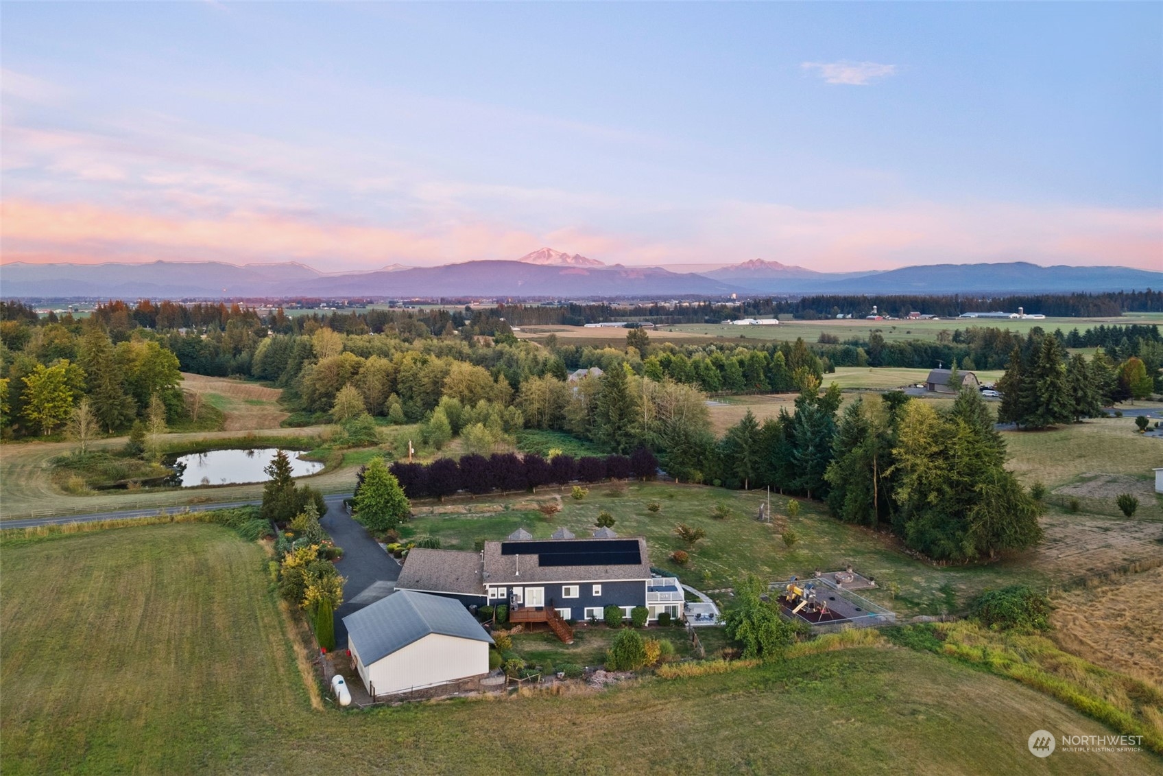 9435 Weidkamp Road Lynden, WA 98264 - Photo 40 of 40 a view of a lake with houses in the back