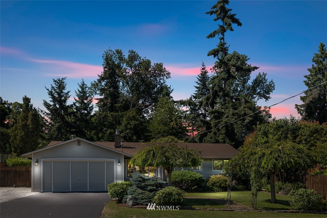 507 South 38th Court Renton, WA 98055 - Photo 1 of 40 a front view of a house with a yard and trees