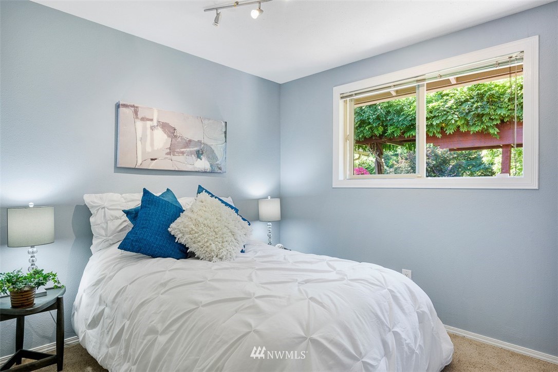507 South 38th Court Renton, WA 98055 - Photo 19 of 40 a bedroom with a bed and a window