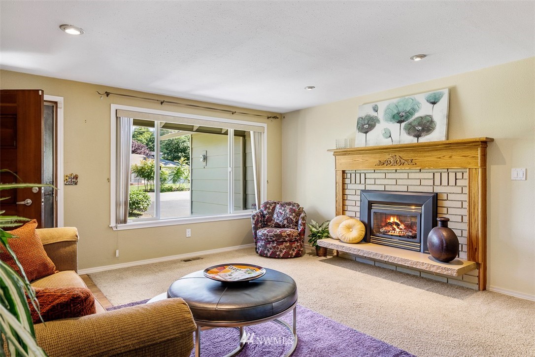 507 South 38th Court Renton, WA 98055 - Photo 3 of 40 a living room with furniture and a fireplace