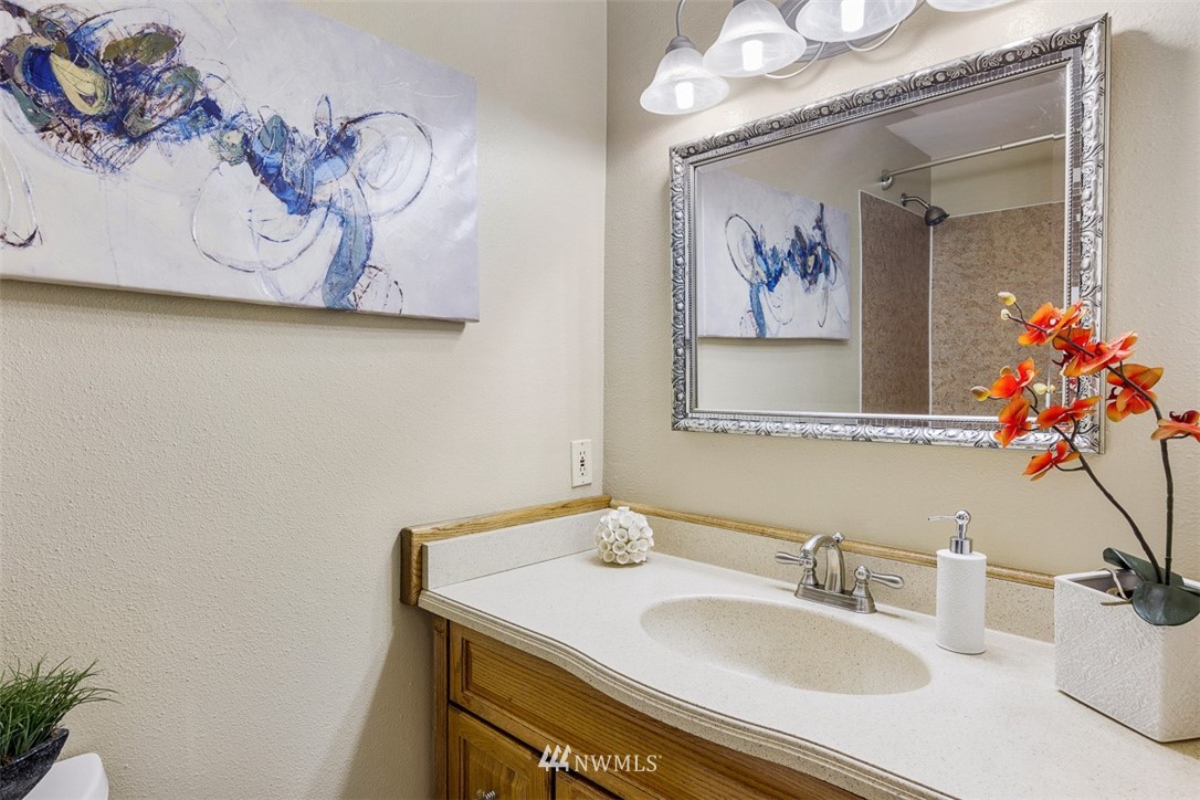 507 South 38th Court Renton, WA 98055 - Photo 21 of 40 a bathroom with a sink vanity and a mirror