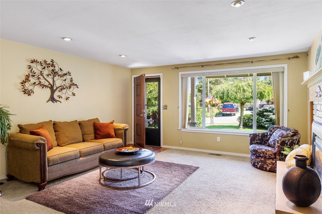 507 South 38th Court Renton, WA 98055 - Photo 4 of 40 a living room with furniture and a large window
