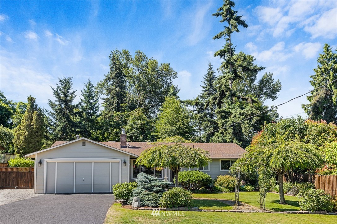 507 South 38th Court Renton, WA 98055 - Photo 35 of 40 a front view of a house with a yard and garage