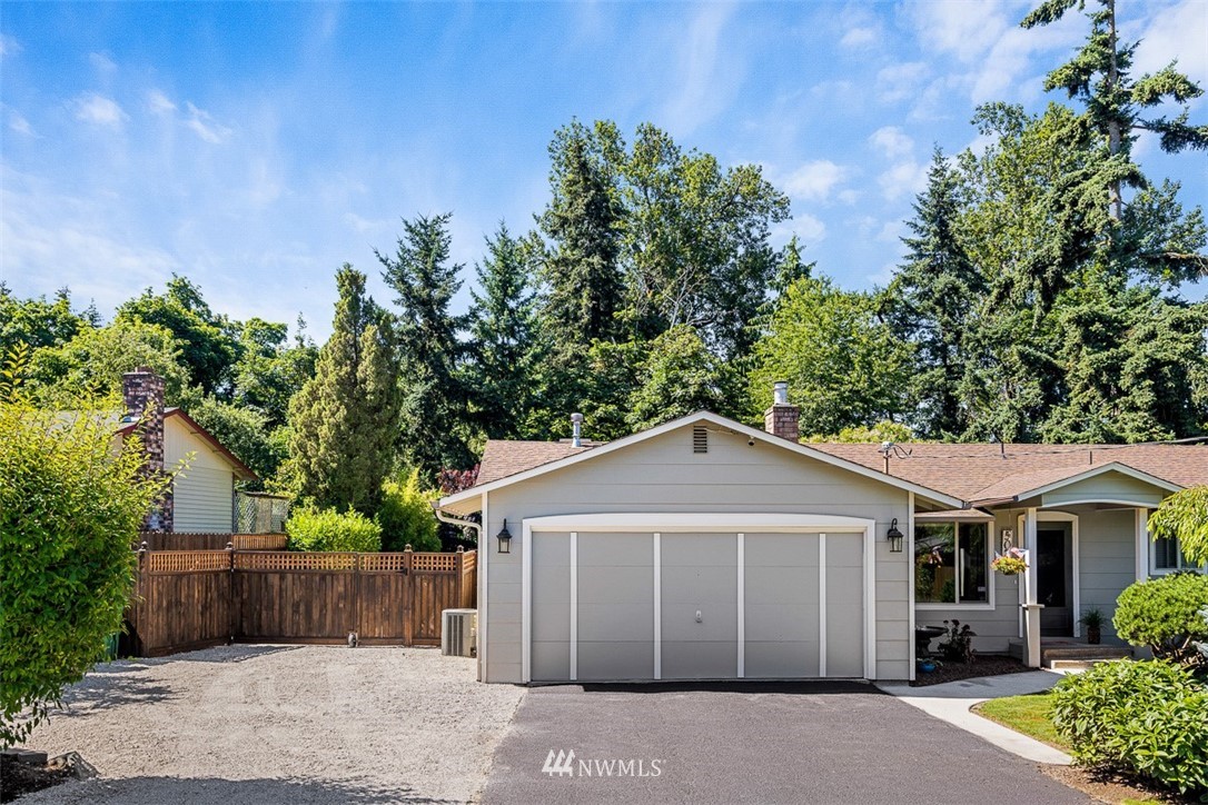 507 South 38th Court Renton, WA 98055 - Photo 39 of 40 a view of a house with a yard plants and large tree