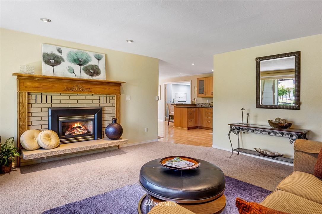 507 South 38th Court Renton, WA 98055 - Photo 5 of 40 a living room with furniture and a fireplace