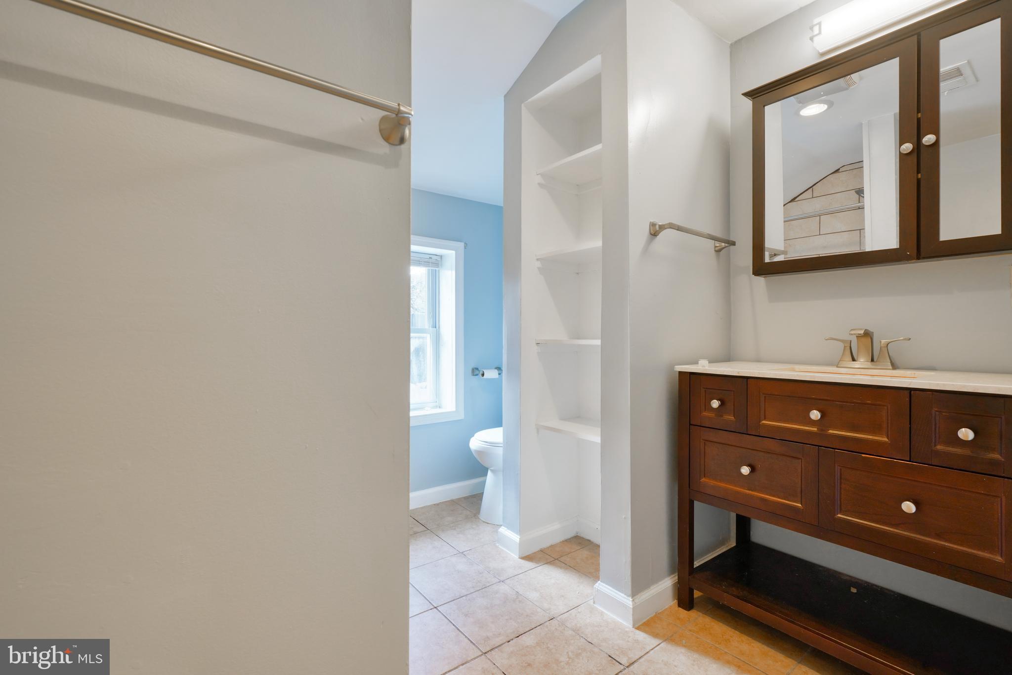 1029 Booth Street Baltimore, MD 21223 - Photo 15 of 21 a bathroom with a sink and a mirror
