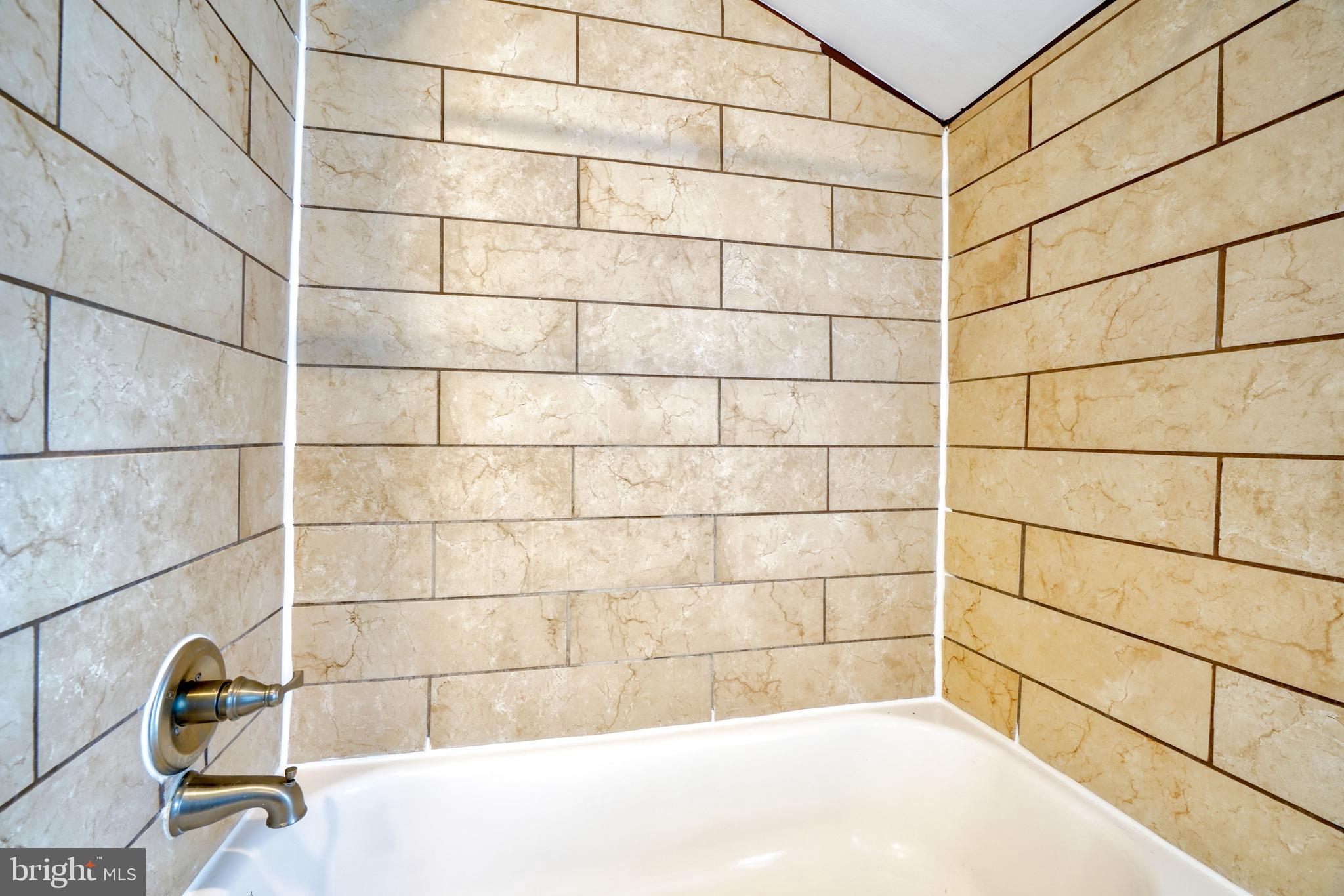 1029 Booth Street Baltimore, MD 21223 - Photo 17 of 21 a bathroom with a bathtub