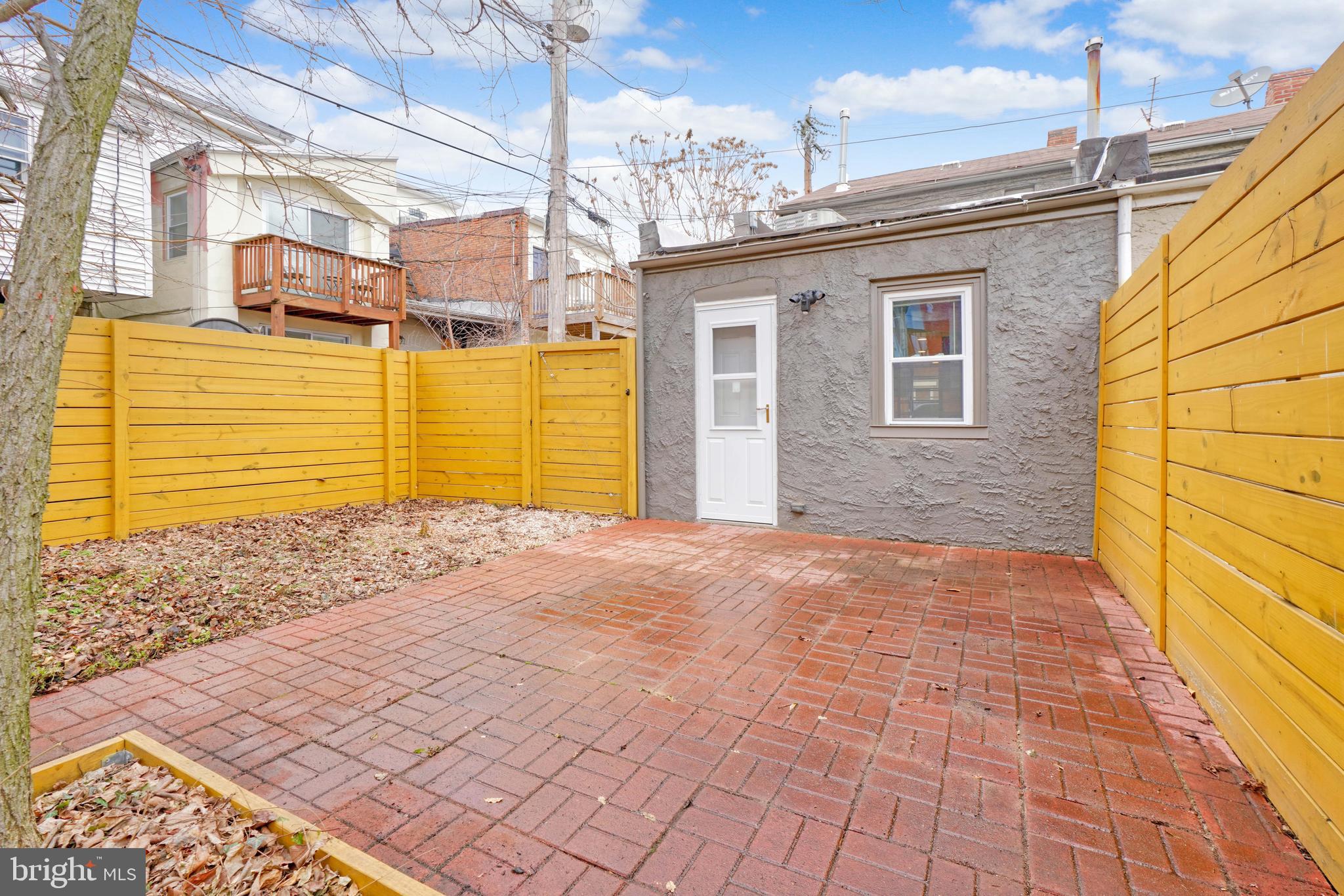 1029 Booth Street Baltimore, MD 21223 - Photo 19 of 21 a view of a house with a backyard