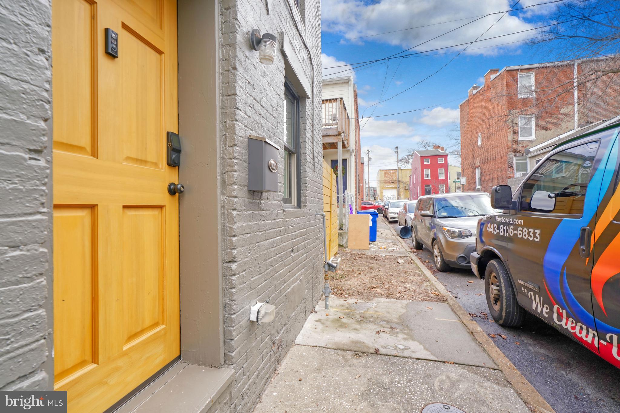 1029 Booth Street Baltimore, MD 21223 - Photo 2 of 21 a view of a porch with furniture and a door