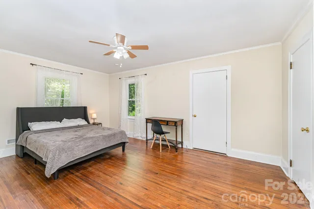 a bedroom with a bed and a table in it