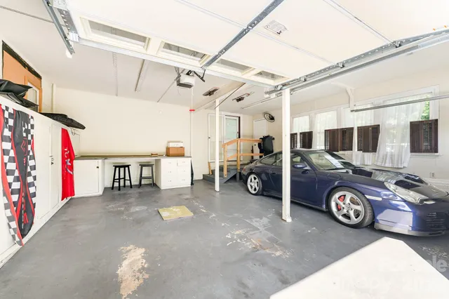 a view of a garage with parked cars