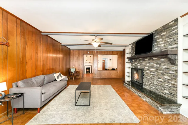 a living room with furniture and a fireplace