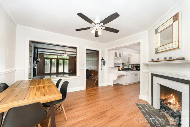 a living room with furniture and fireplace
