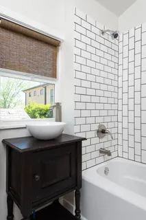 a bathroom with a sink and a bathtub