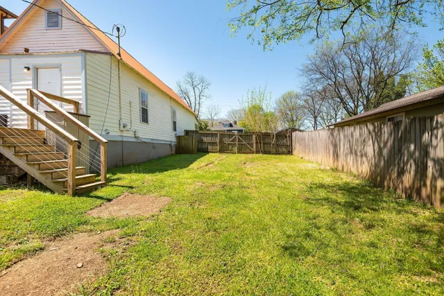 a view of swimming pool with a backyard