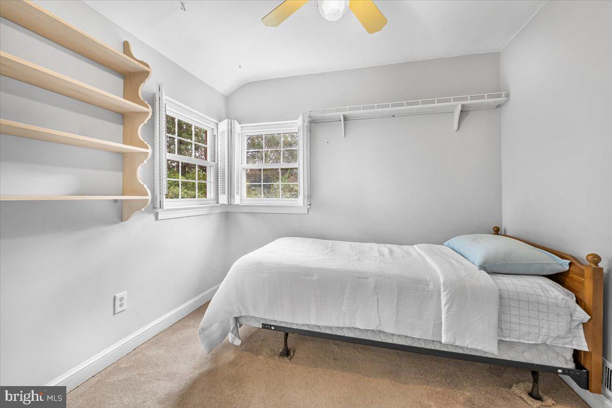 10101 Portland Road Silver Spring, MD 20901 - Photo 17 of 33 a bedroom with a bed and a window