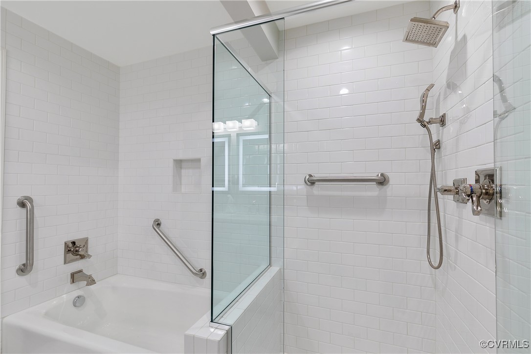 413 Stuart Circle, Unit 5E Richmond, VA 23220 - Photo 26 of 44 a bathroom with a bathtub and a shower
