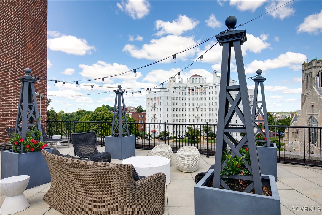413 Stuart Circle, Unit 5E Richmond, VA 23220 - Photo 35 of 44 a view of a terrace with couches potted plants and sky view
